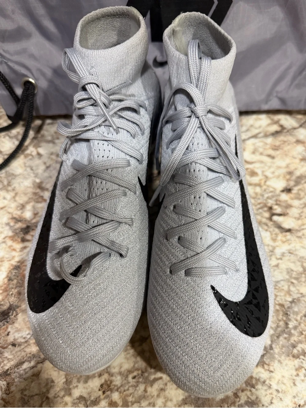 Nike Men’s Light Gray High-Top Soccer Cleats with Black Swoosh